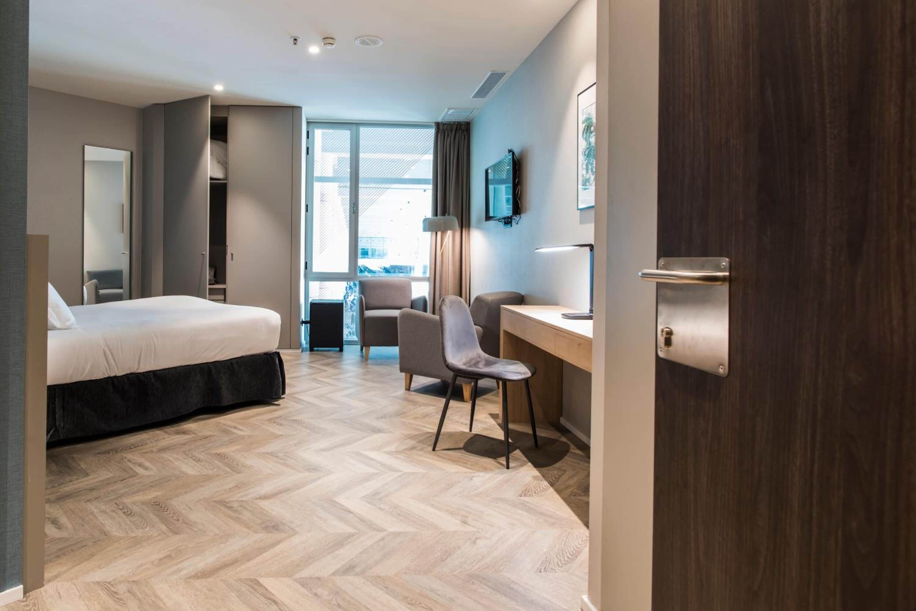 premium double room, private bathroom | down duvets, minibar, desk, blackout curtains