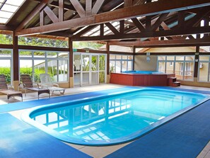Indoor pool, open 10:00 AM to 10:00 PM, pool loungers