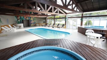 Indoor pool, open 10:00 AM to 10:00 PM, pool loungers