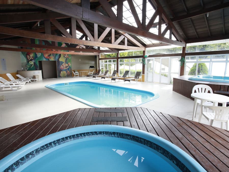 Indoor pool, open 10:00 AM to 10:00 PM, pool loungers