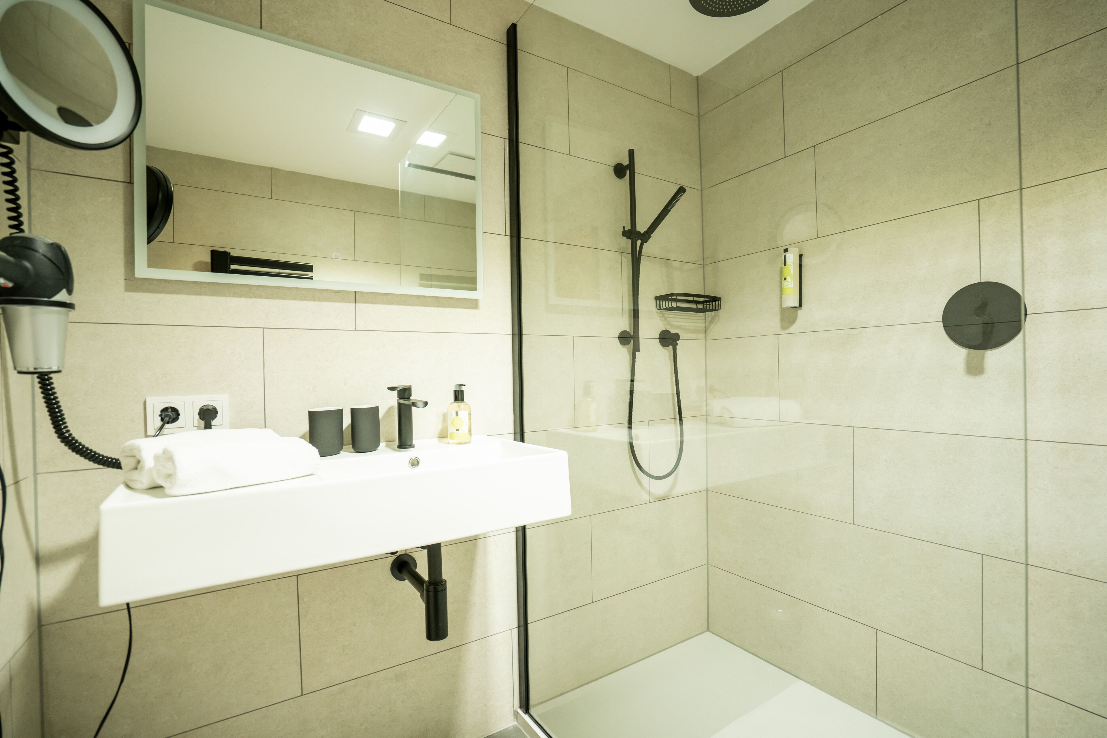 junior studio suite | bathroom | hair dryer, bathrobes, towels, soap