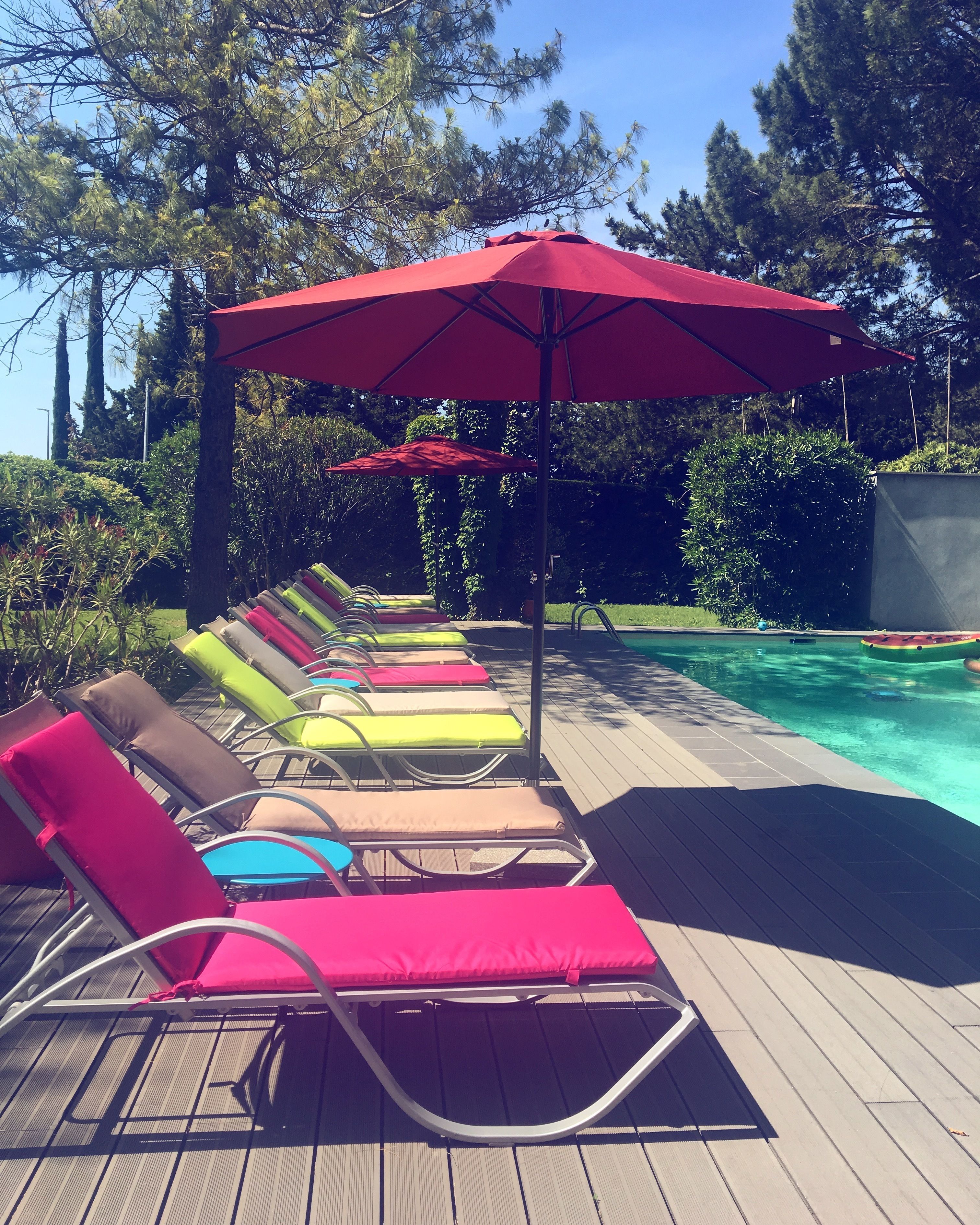 seasonal outdoor pool, open 9:00 am to 8:00 pm, pool loungers