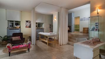 Relax in a cozy seating area with a plush sofa and bench, perfect for unwinding.