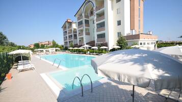Seasonal outdoor pool, pool umbrellas, sun loungers
