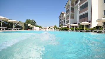 Seasonal outdoor pool, pool umbrellas, sun loungers