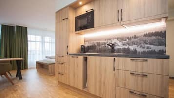 Superior Studio | Private kitchen | Full-sized fridge, microwave, stovetop, dishwasher