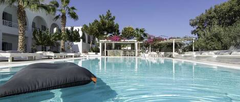 Seasonal outdoor pool, pool umbrellas, pool loungers