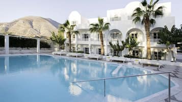 Seasonal outdoor pool, pool umbrellas, pool loungers