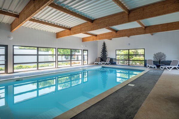Indoor pool, open 9 AM to 8:00 PM, pool loungers