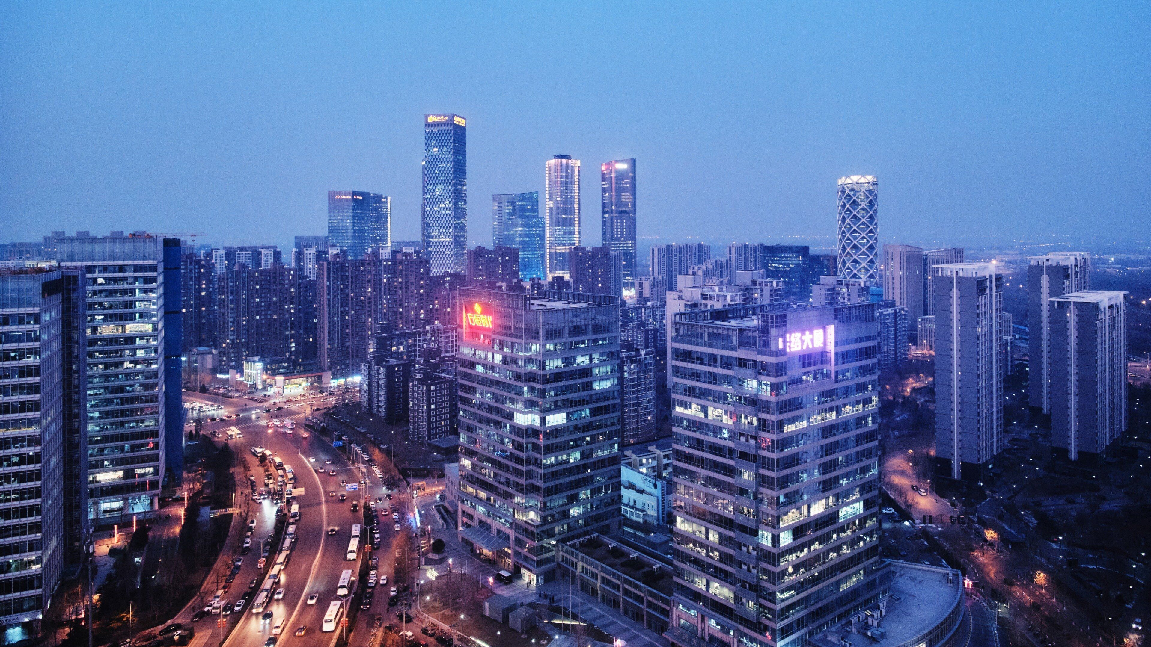 A high-rise urban area with modern buildings and busy streets.