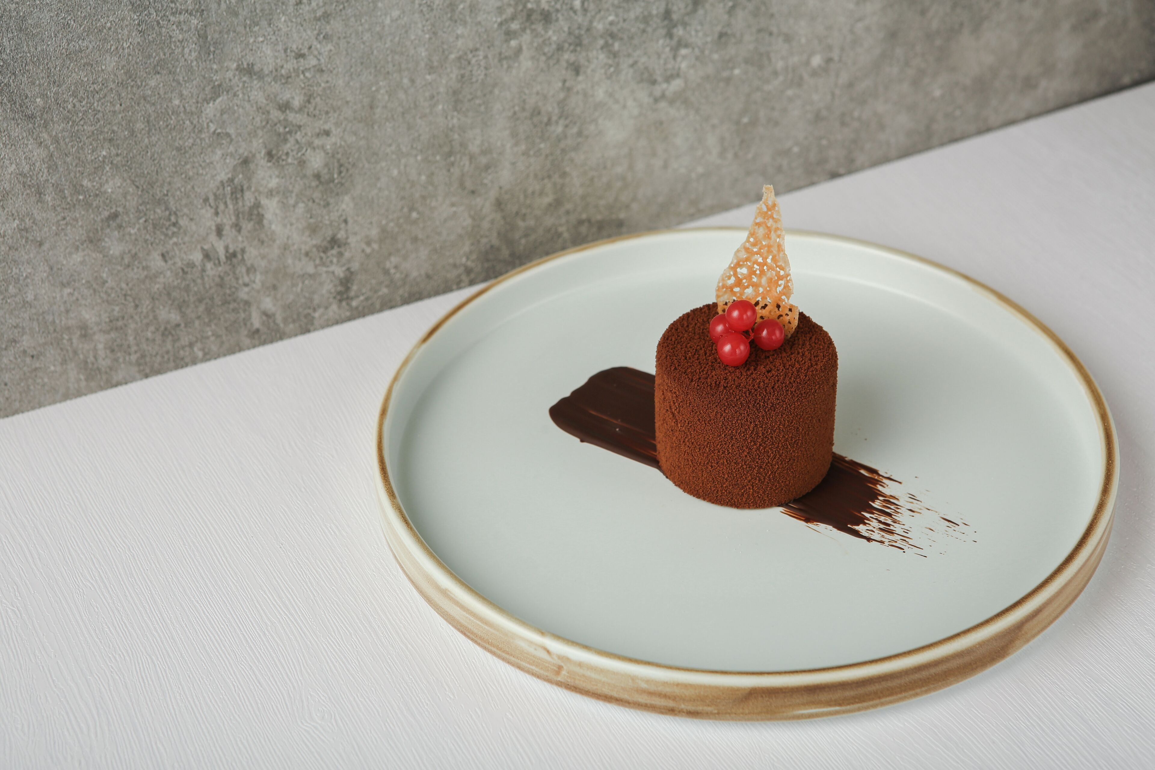 A dessert on a plate with a textured background.