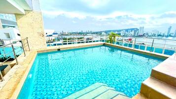 Outdoor pool, pool umbrellas, pool loungers