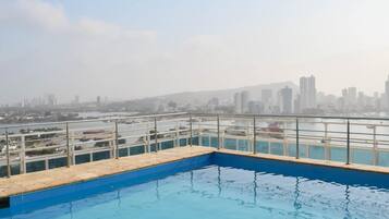 Outdoor pool, pool umbrellas, pool loungers