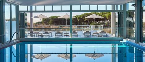 Indoor pool, seasonal outdoor pool, pool umbrellas, pool loungers