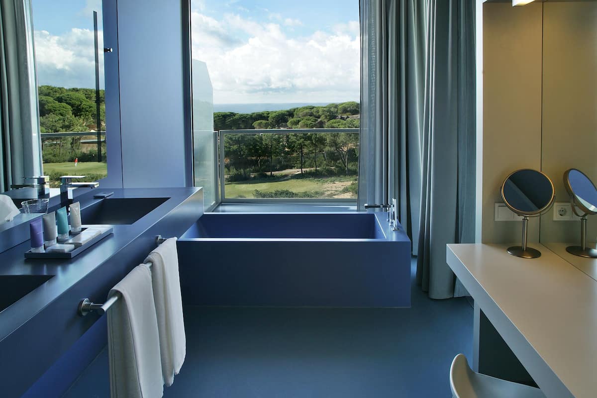 premium bedding, down duvets, minibar, in-room safe