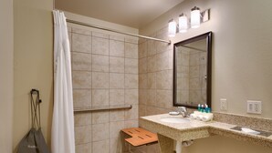 A bathroom with a shower, a sink, and a mirror. - Holiday Inn Express & Suites Orem-North Provo by IHG (Orem)