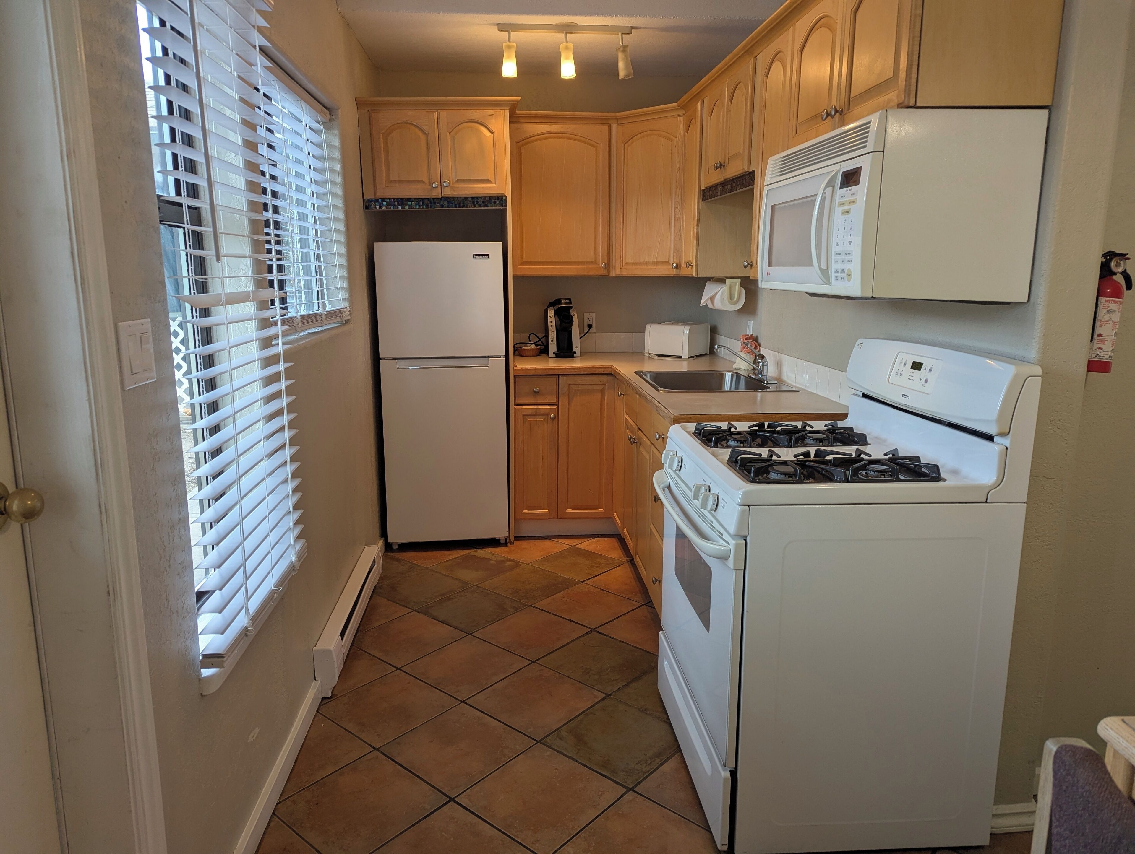 Family Suite, 3 Bedrooms | Private kitchen | Microwave, coffee/tea maker