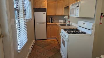 Family Suite, 3 Bedrooms | Private kitchen | Microwave, coffee/tea maker