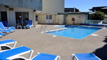 Relax by the pool surrounded by lounge chairs and enjoy the scenic views.