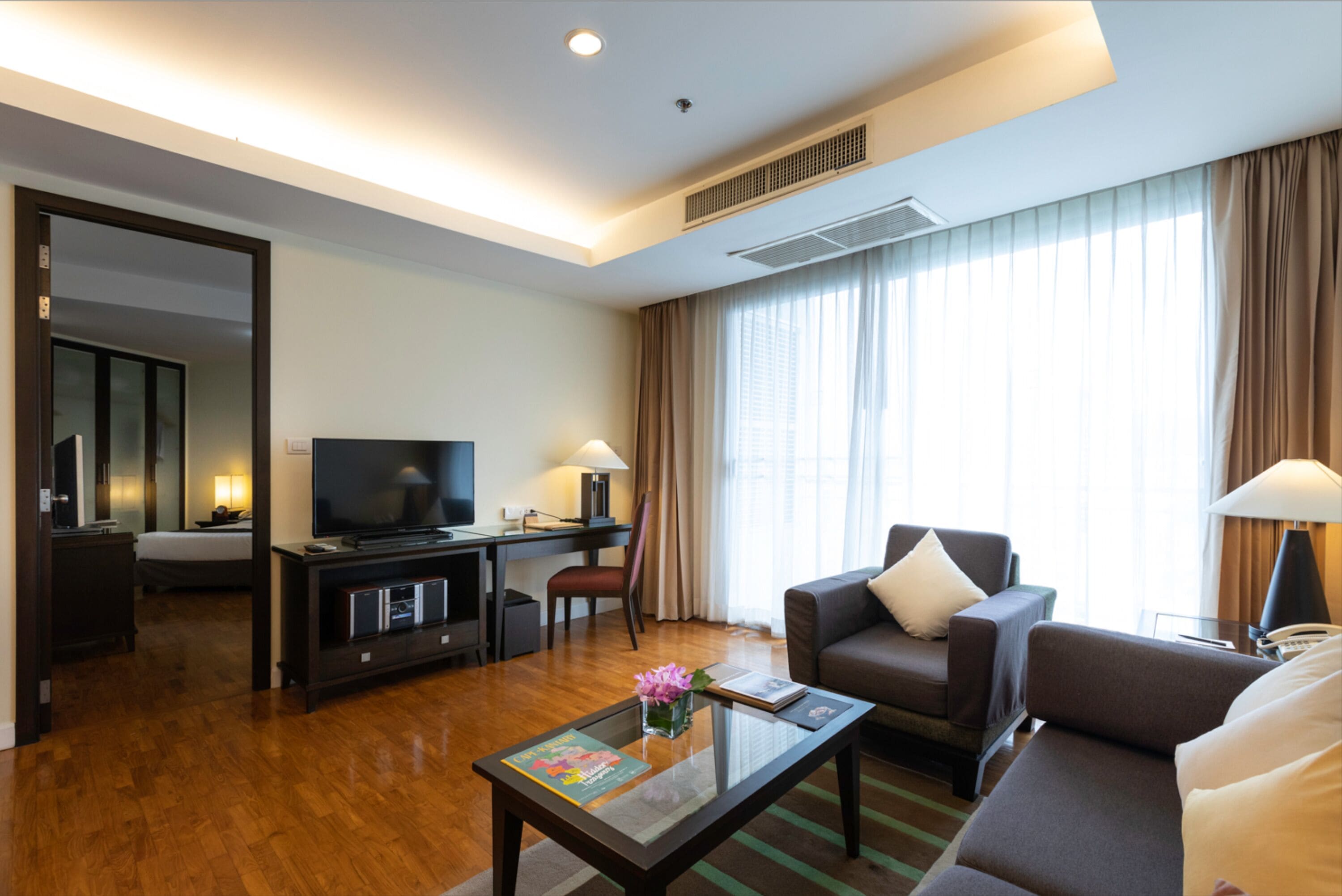 one bedroom suite | living area | 32-inch lcd tv with satellite channels, tv, dvd player