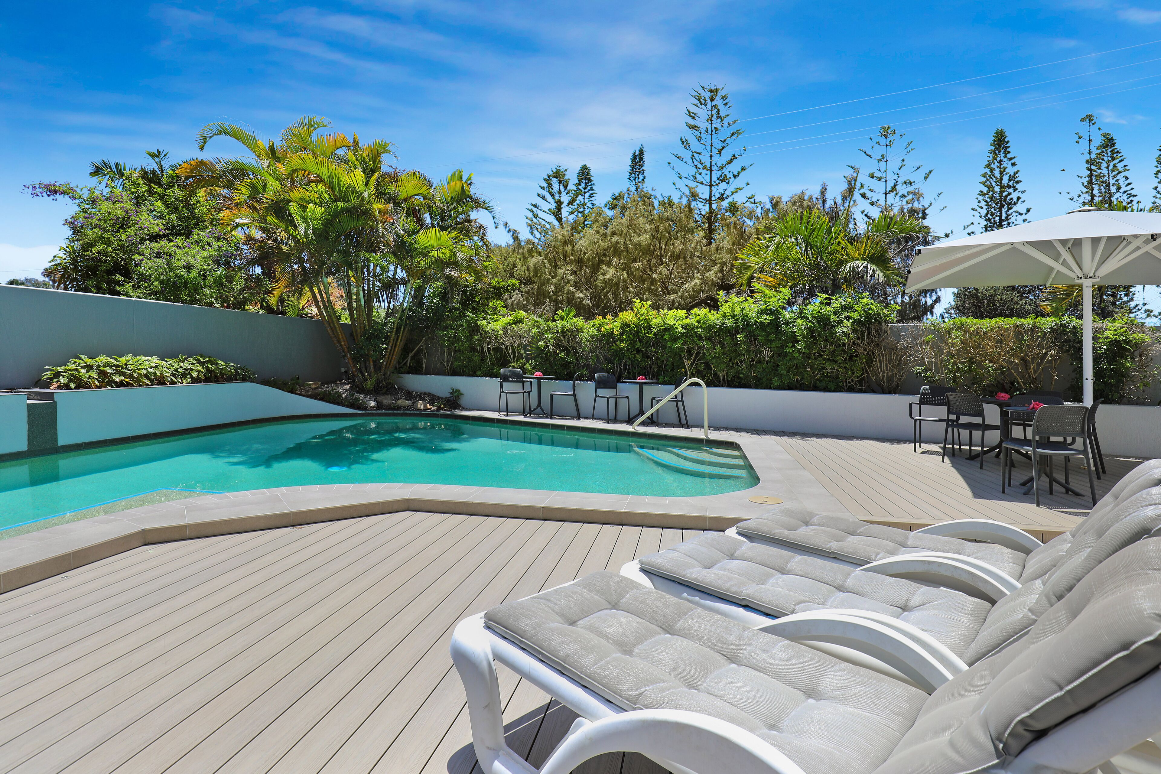 Outdoor pool, pool umbrellas, sun loungers