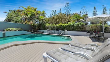 Outdoor pool, pool umbrellas, sun loungers