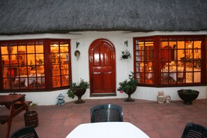 Front of property - evening/night - Thatchings Guest House (Curry's Post)