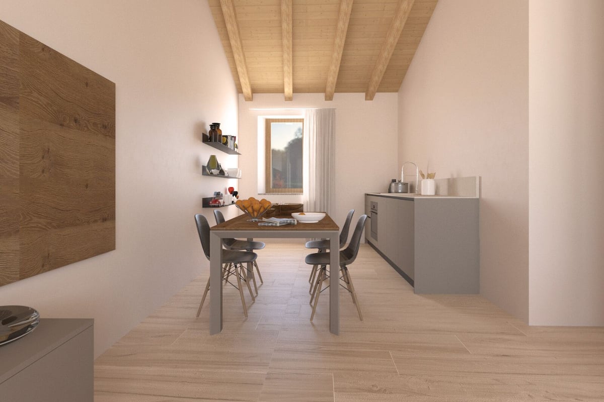 Una cocina moderna con techo de madera, zona de comedor con mesa y sillas de madera, y encimera de cocina empotrada.