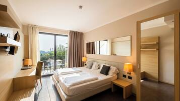 Hypo-allergenic bedding, down comforters, minibar, in-room safe