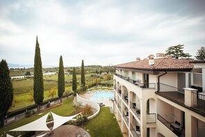 Relax by the rooftop pool surrounded by lush greenery and take in the breathtaking views of the surrounding landscape.