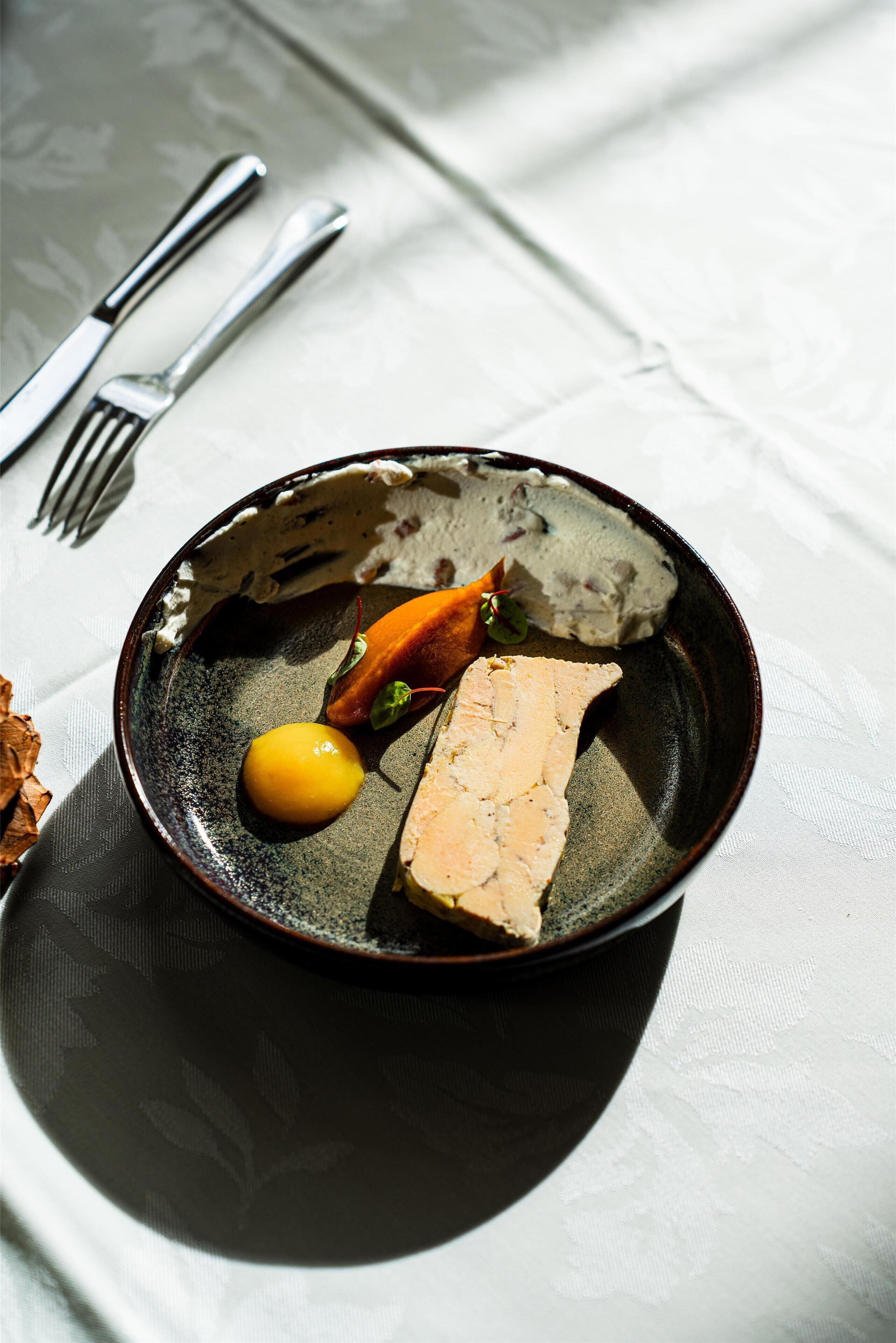 A plate with food items on a table.
