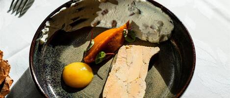 A plate with food items on a table.