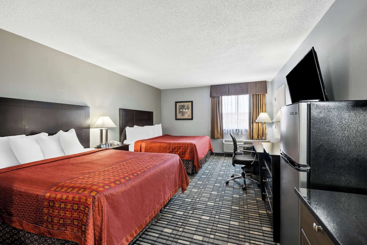 Standard Room, 2 Queen Beds, Non Smoking, Kitchenette | 1 bedroom, desk, laptop workspace, free rollaway beds