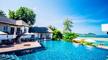 Outdoor pool, open 8 AM to 8 PM, pool umbrellas