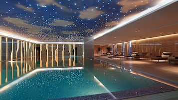 Indoor pool, pool loungers, lifeguards on site