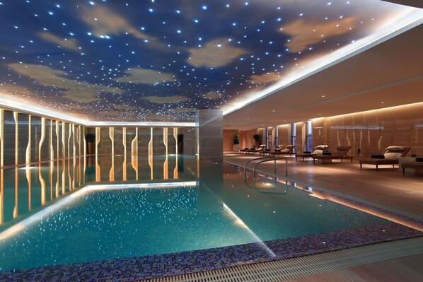 Indoor pool, pool loungers, lifeguards on site