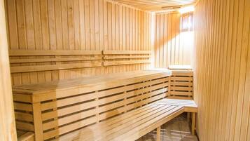 A sauna with wooden benches and slatted seating.