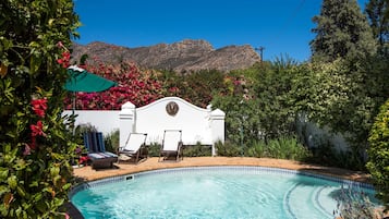 Outdoor pool, pool umbrellas, pool loungers