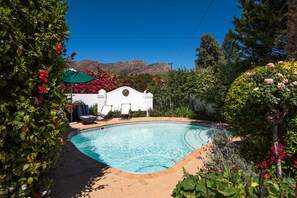 Outdoor pool, pool umbrellas, sun loungers