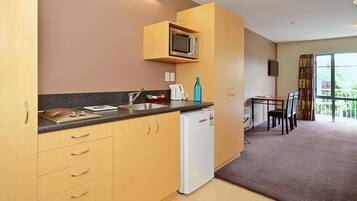 Fridge, microwave, stovetop, cookware/dishes/utensils