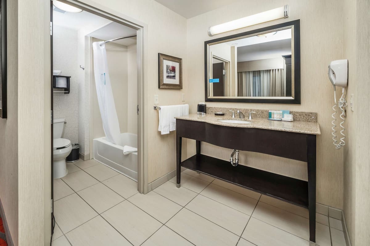 studio suite, 1 king bed | bathroom | shower, free toiletries, hair dryer, towels