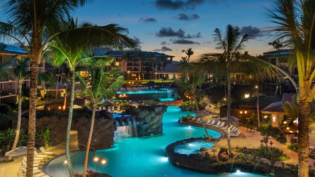 A resort with a large pool, palm trees, and a waterfall. - Koloa Landing Resort at Poipu, Autograph Collection (Koloa)