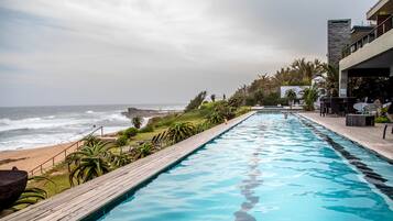 Seasonal outdoor pool, pool umbrellas, sun loungers