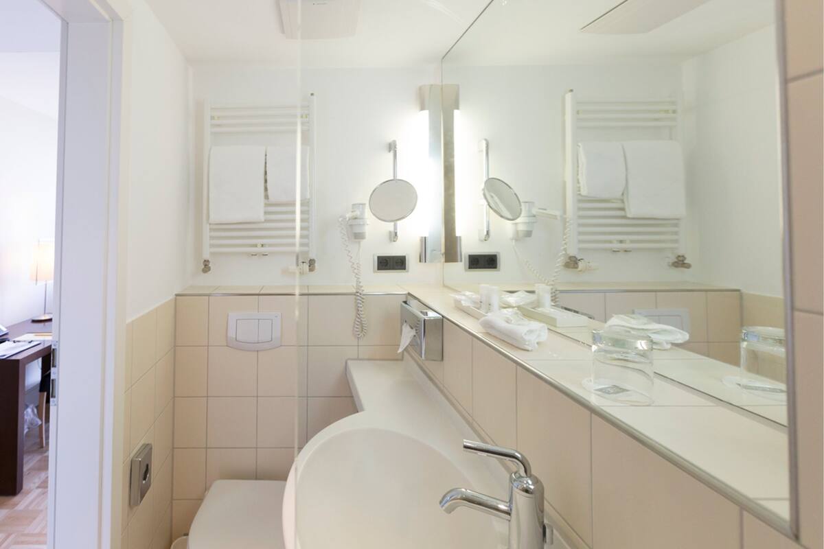 single room (cube) | bathroom | hair dryer, slippers, towels, soap