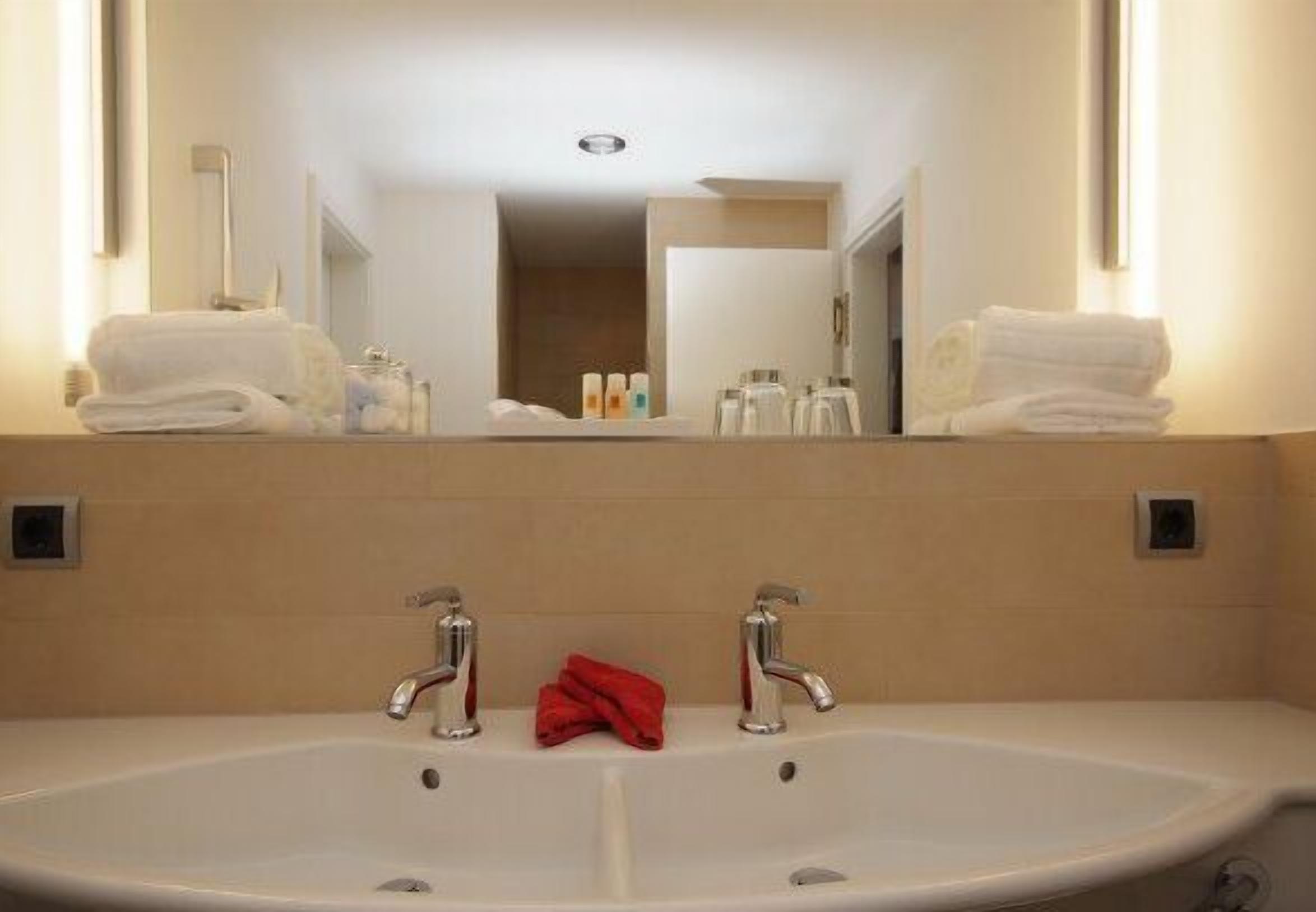 loft | bathroom | hair dryer, slippers, towels, soap