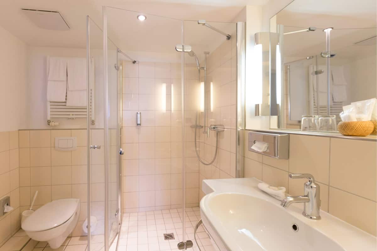 classic double room | bathroom | hair dryer, slippers, towels, soap