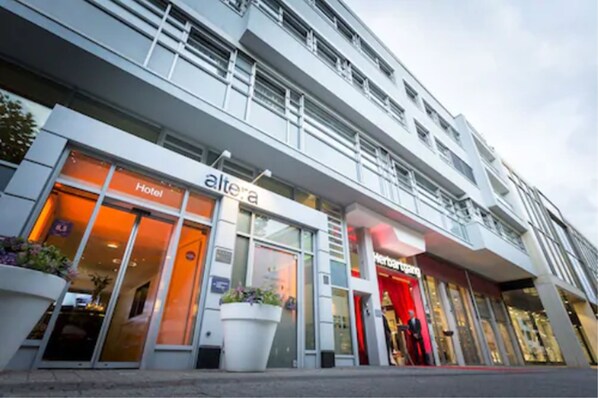 Hotel Altera's sleek entrance welcomes guests to a contemporary stay.