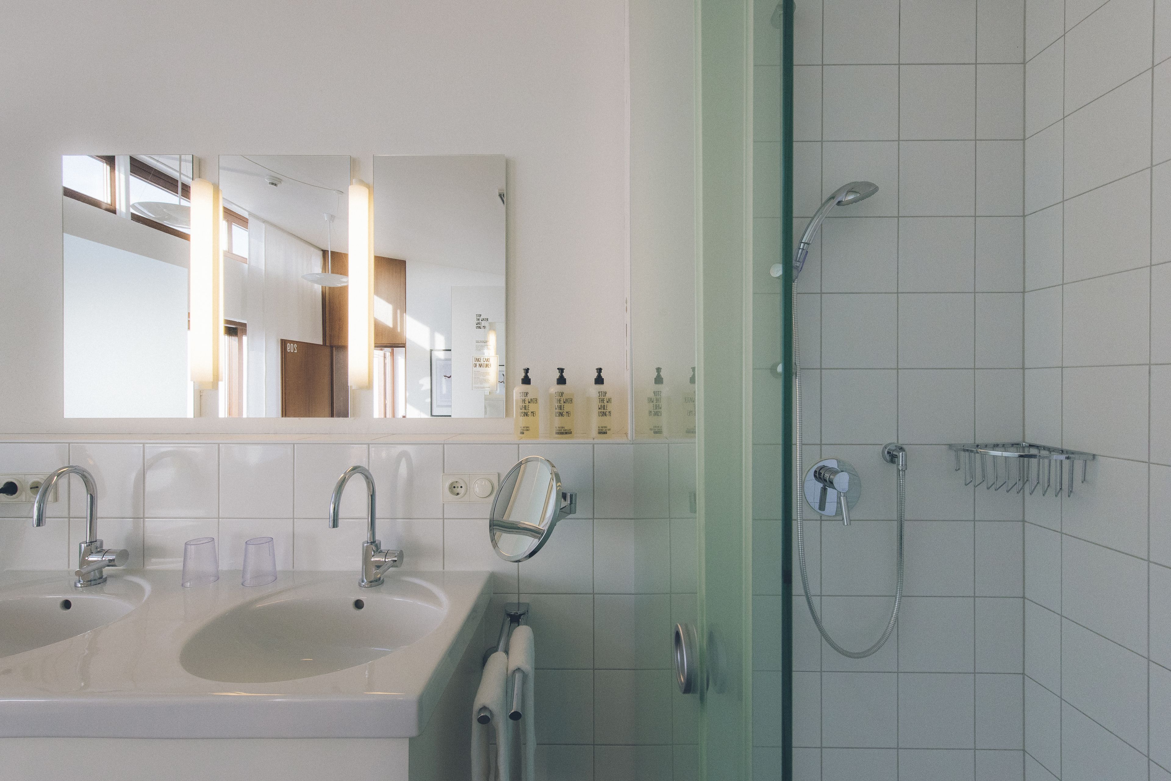 designer toiletries, hair dryer, towels