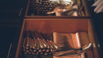 A drawer containing various kitchen utensils.