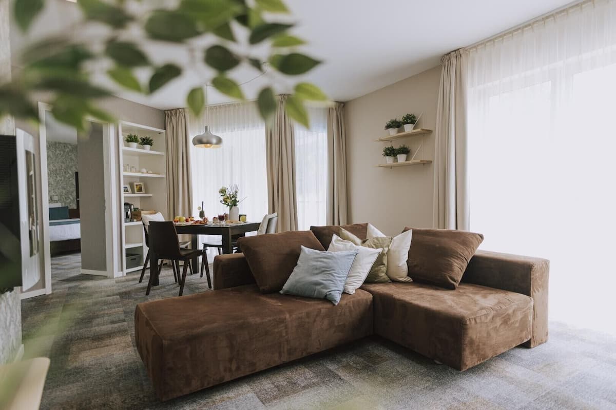 deluxe studio suite, 1 king bed, sauna, pool view | living area | lcd tv, pay films